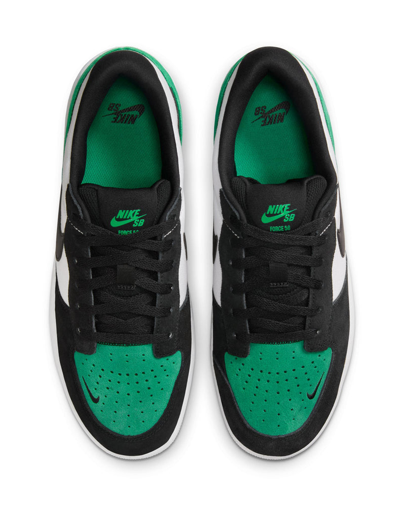 Top view of black, white, and green Nike SB sneakers with green insoles, black laces, and a small black swoosh on the toe box.