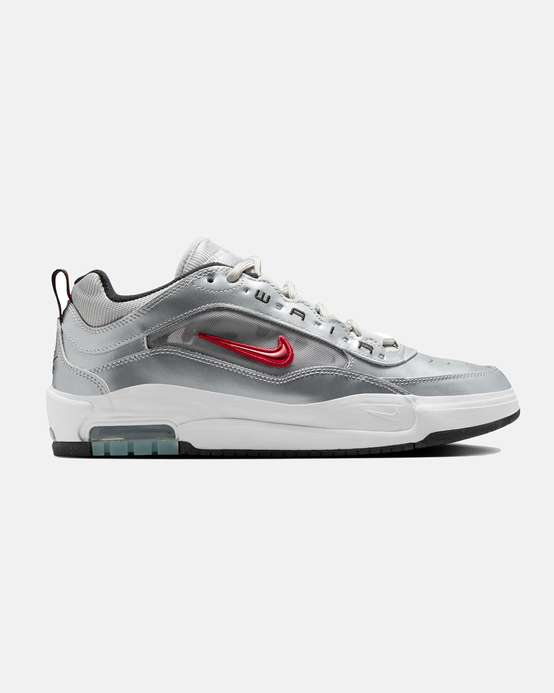 Side view of a silver Nike Air Max sneaker with a red swoosh, white midsole, and black outsole featuring a visible air unit.