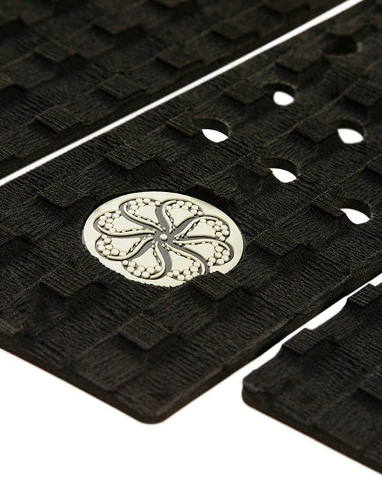 Close-up of waffle texture with white logo and precision-cut holes on centre grip panel