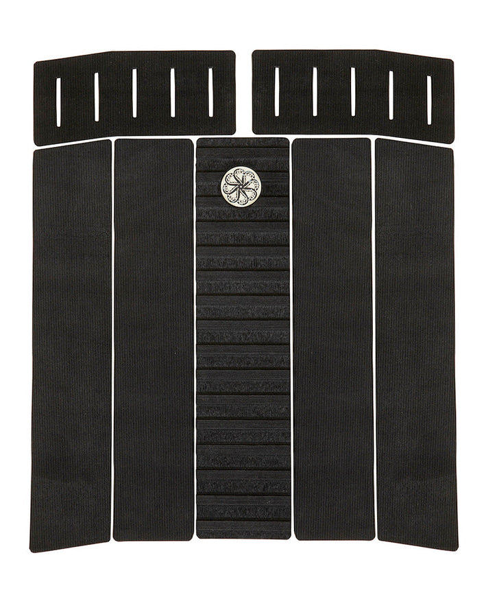 Six-piece black surfboard traction pad with ribbed texture, centre arch bar, and slotted front pads.