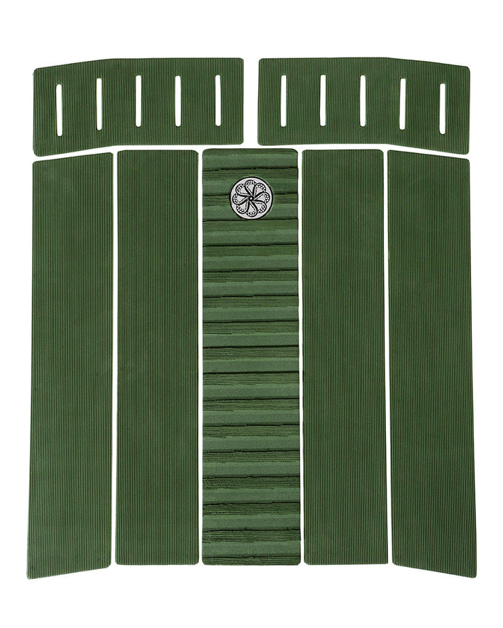 Five-piece green surfboard traction pad with central arch, ribbed texture, and slotted front pads.