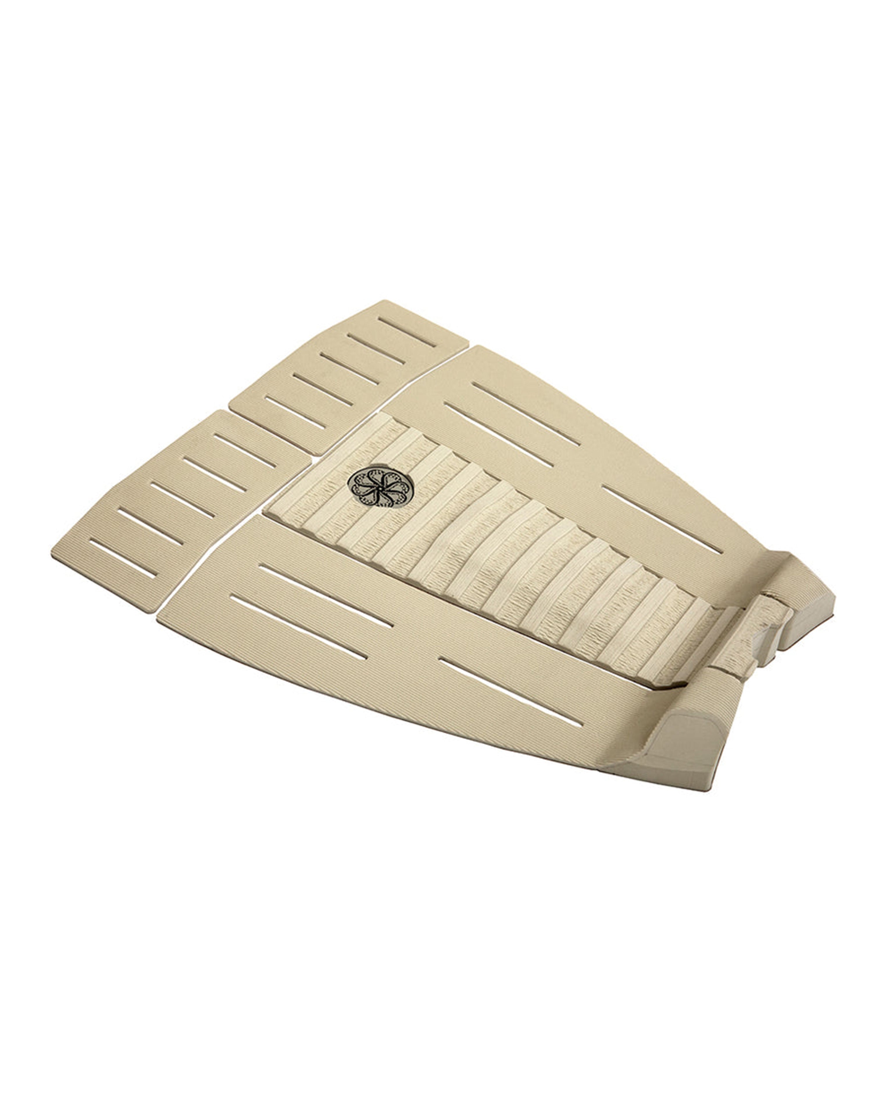 Angled view of beige surfboard pad with high kicktail, centre arch, and slotted grip panels