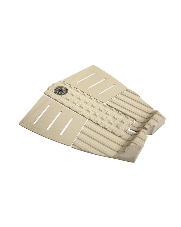 Side view of beige 3-piece tail pad showing arch, kicktail and deep groove texture