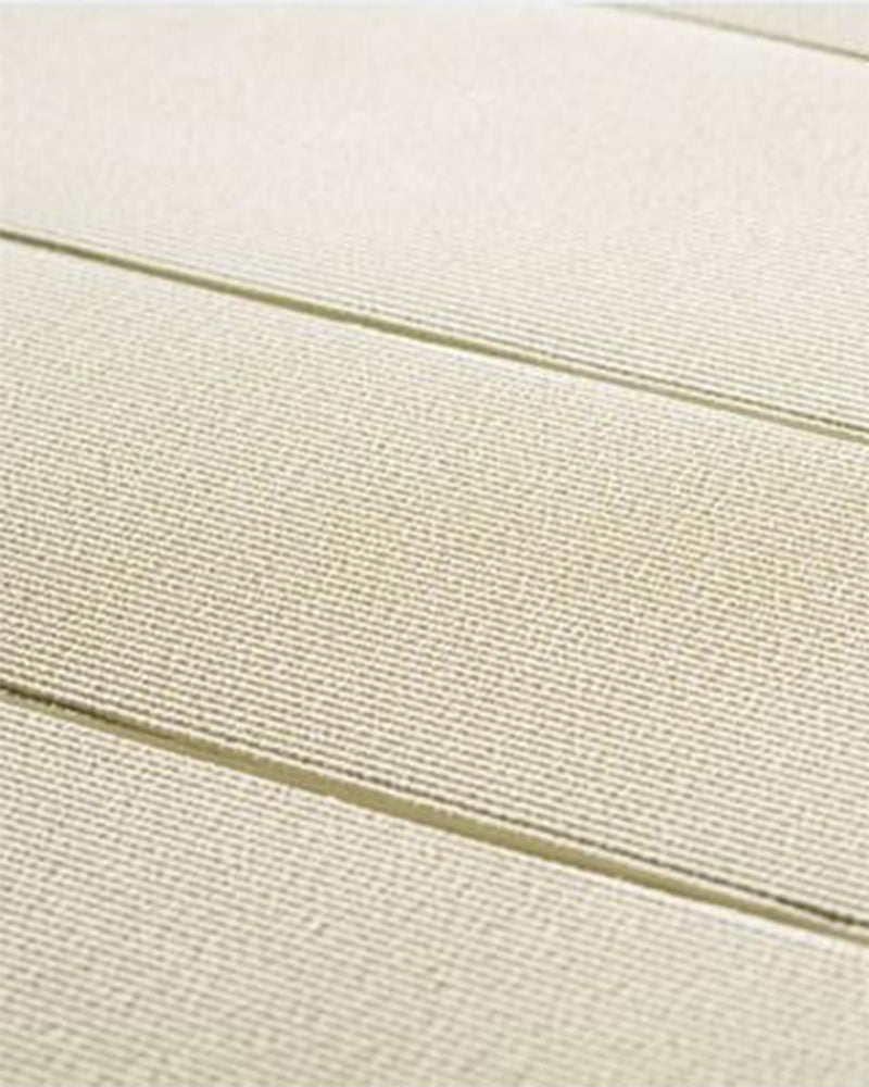 Close-up of beige fabric with horizontal stitching lines