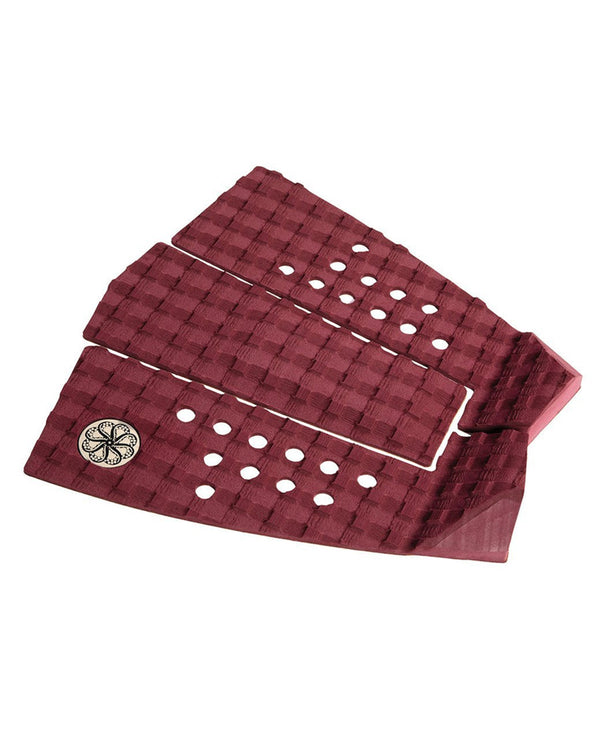 Angled view of burgundy three-piece tail pad with arch bar and kick tail.