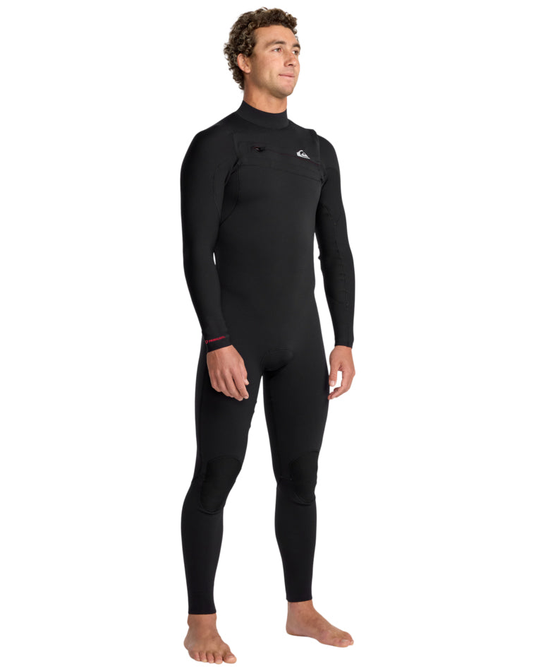 Side angle of the black full-length Quiksilver wetsuit, showing chest zip and knee panels.