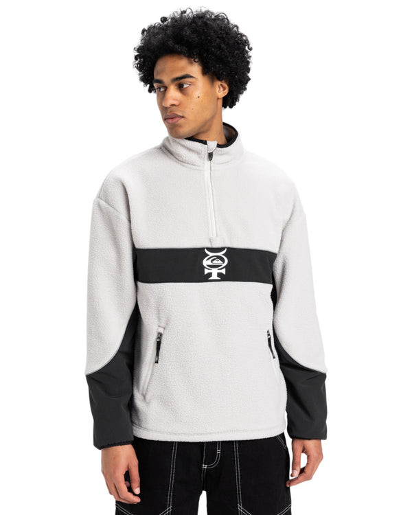 Men's light grey and black Quiksilver fleece pullover with a quarter-zip, contrast panel, and logo at chest.