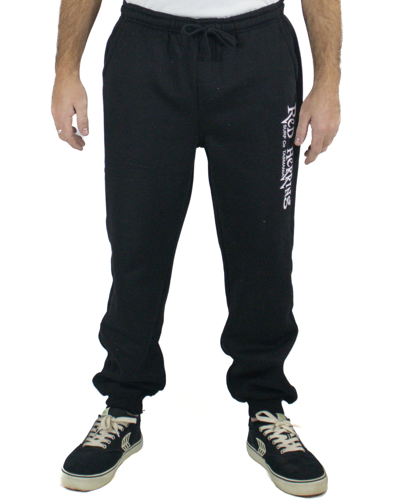 Black track pants with drawstring waist and Red Herring Surf Co. Tasmania logo on leg