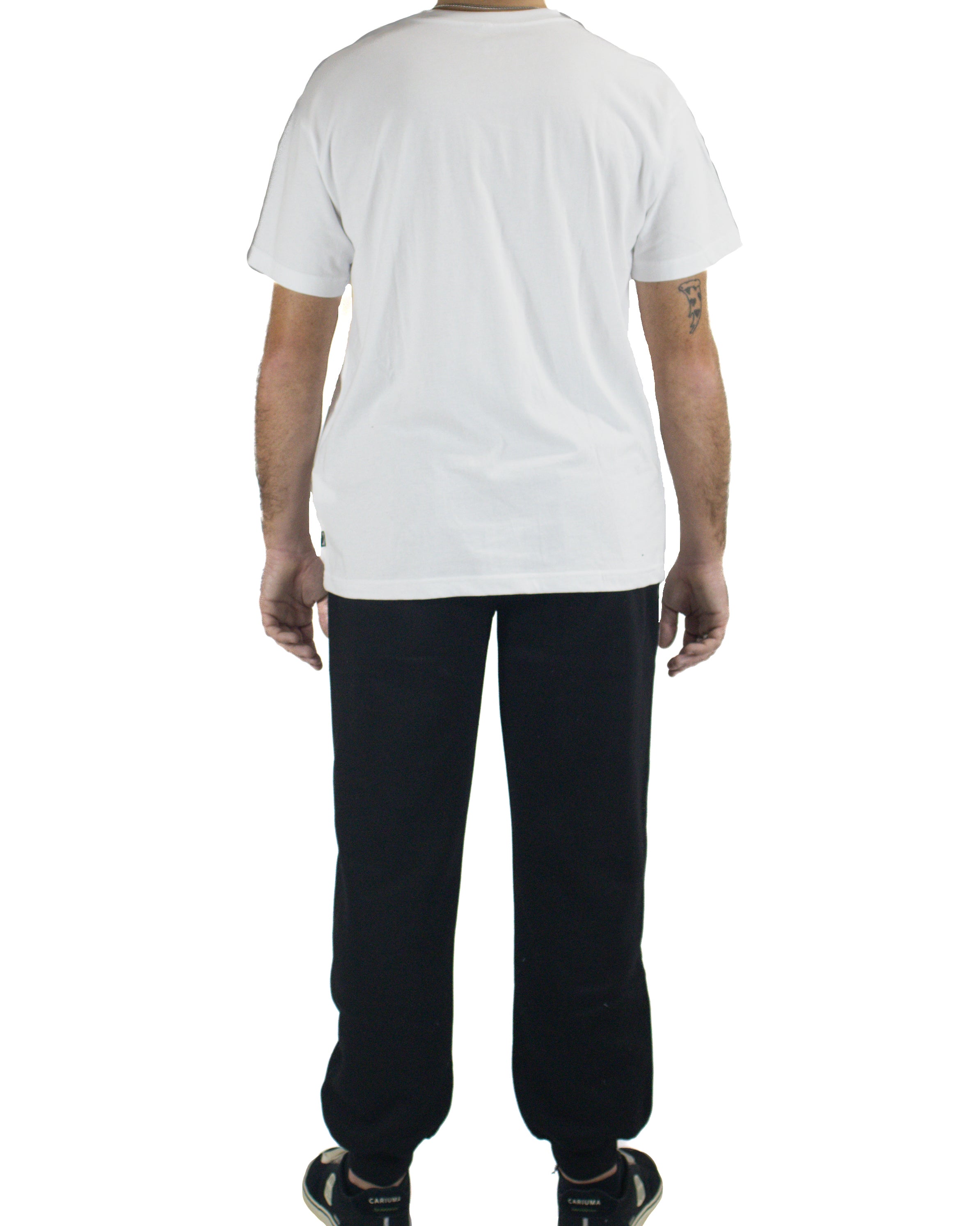 Back view of black cuffed track pants worn with white tee and sneakers