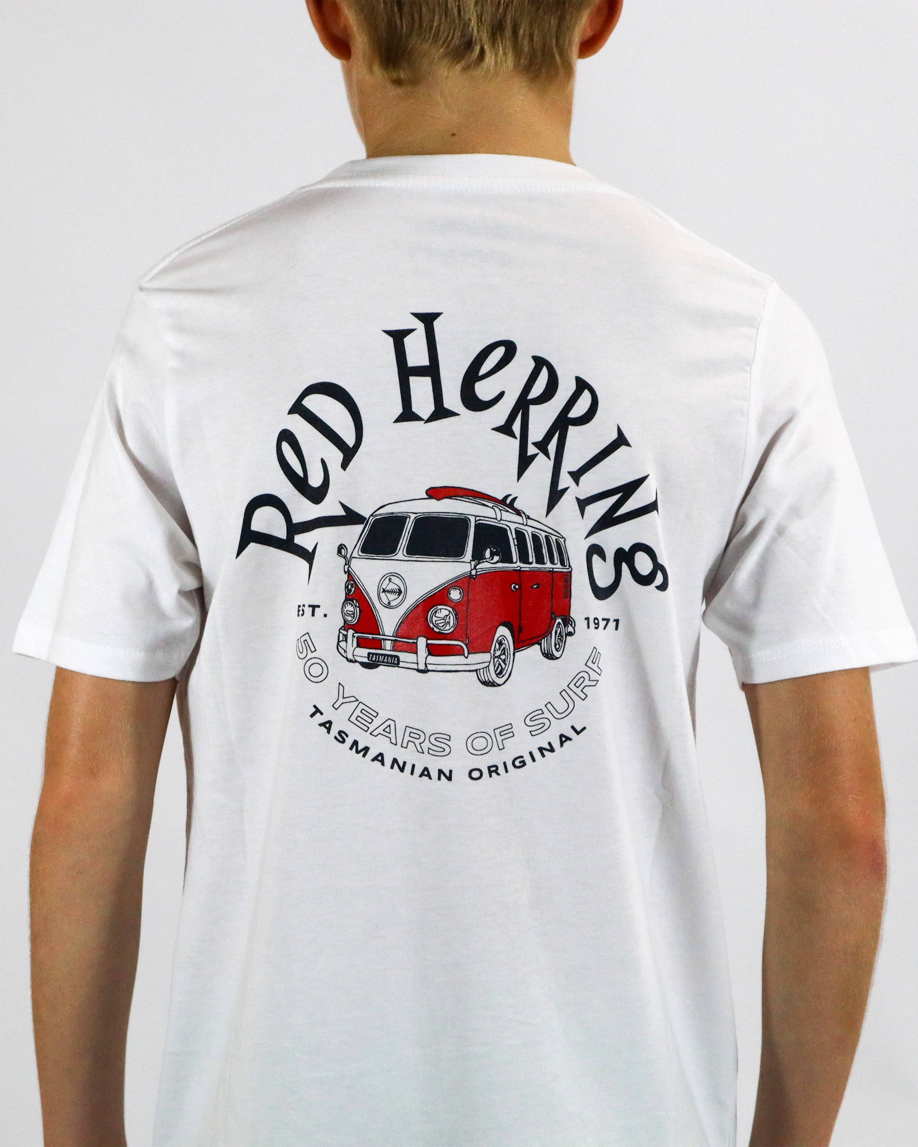 Back of white t-shirt featuring a large Red Herring logo with red van and "50 Years of Surf" text.