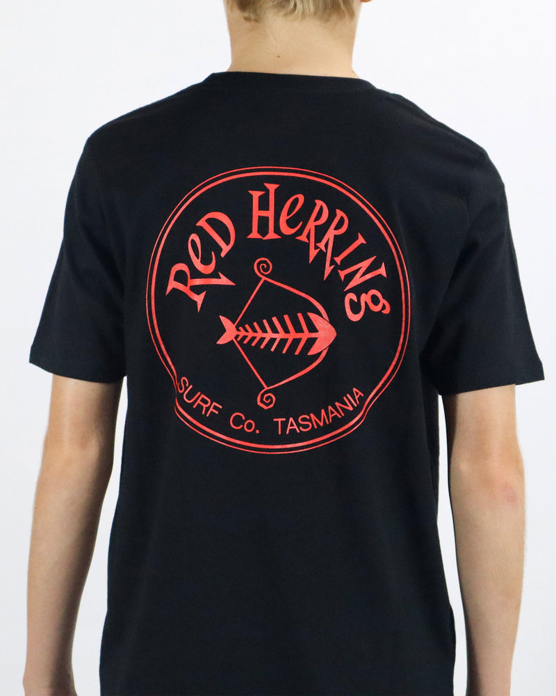 Back view of a black Red Herring t-shirt with large red circular logo reading Surf Co. Tasmania
