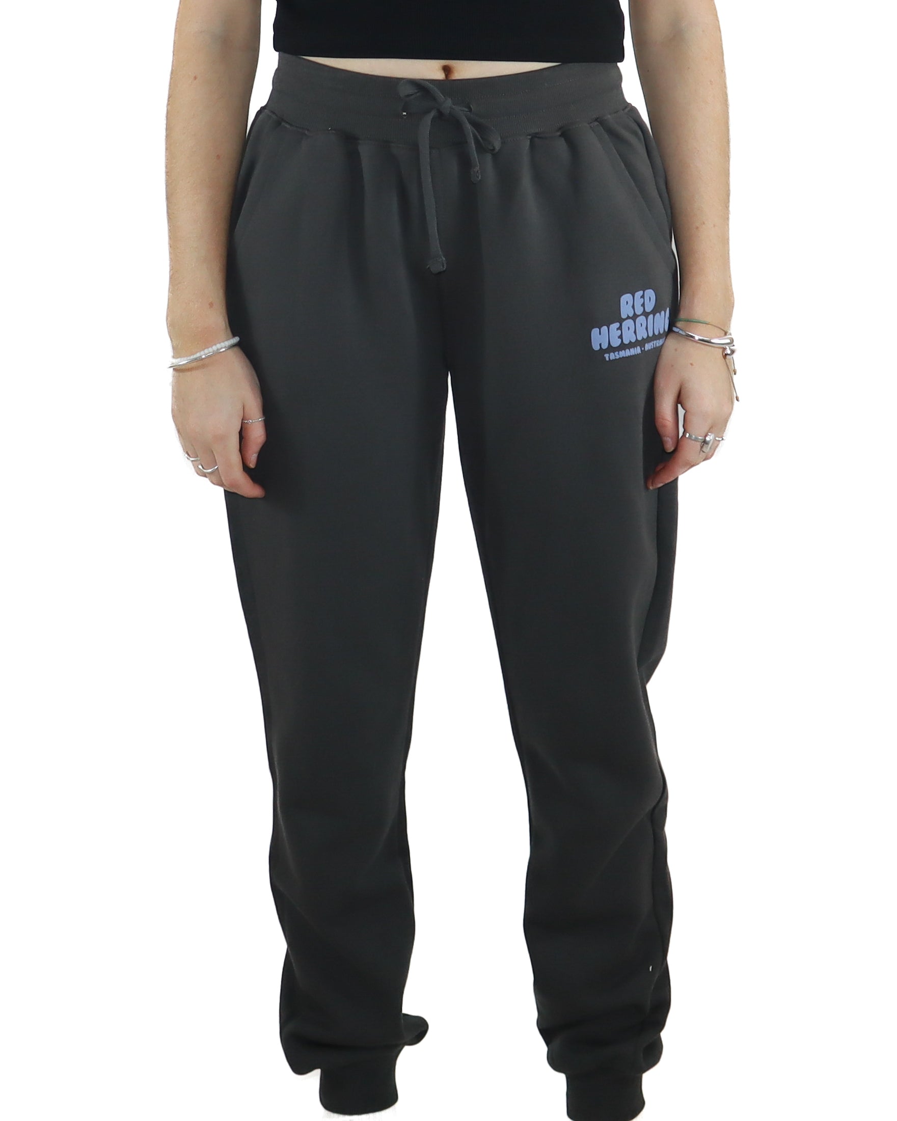 Front view of black jogger pants with drawstring waist and Red Herring Tasmania Australia logo on the thigh.