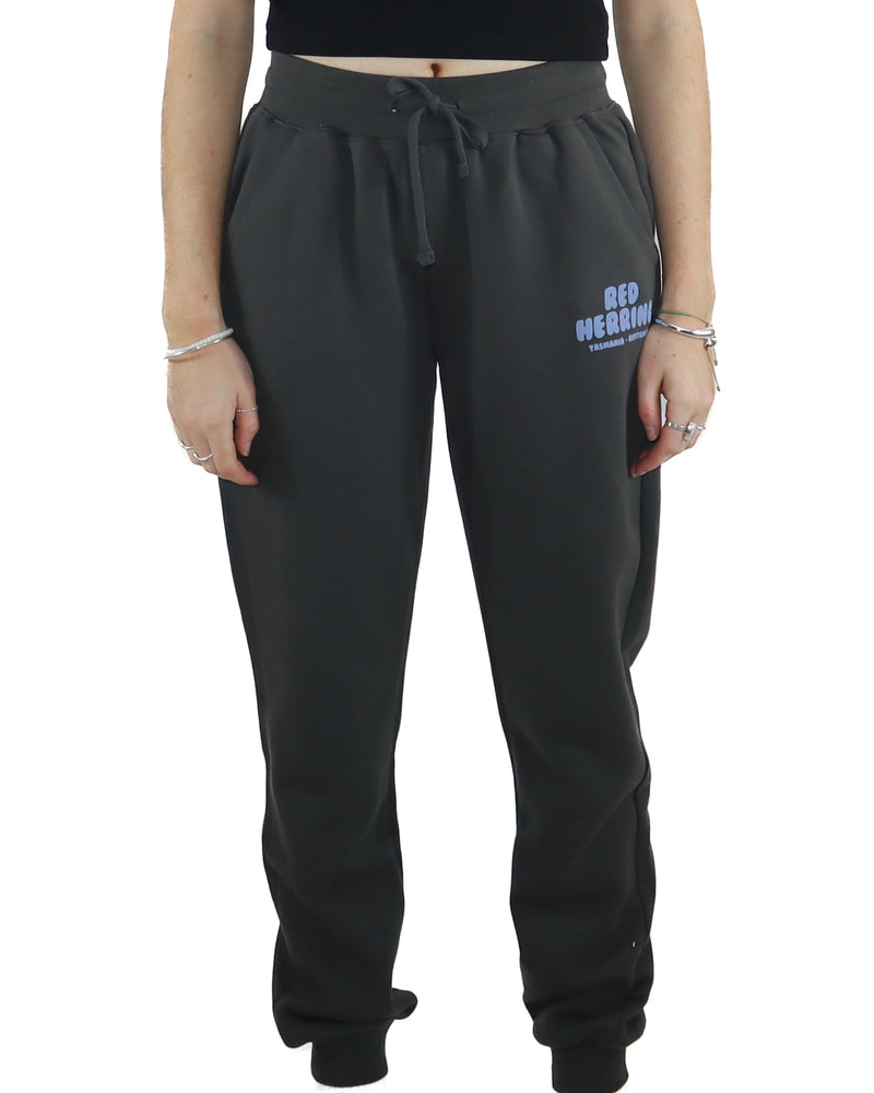 Front view of black jogger pants with drawstring waist and Red Herring Tasmania Australia logo on the thigh.