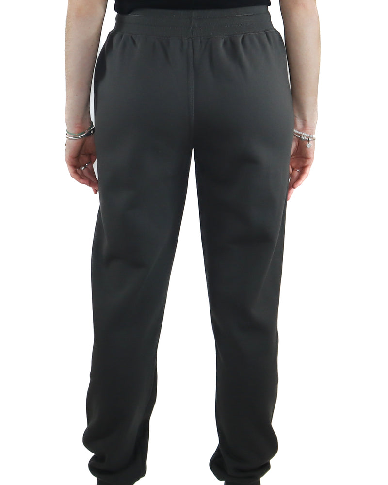 Back view of black jogger pants with elastic waistband and tapered legs.