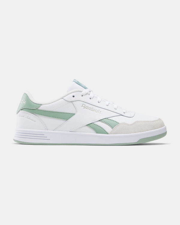 Side view of white Reebok sneakers with pastel green accents, featuring a low-cut design and a minimalist aesthetic.