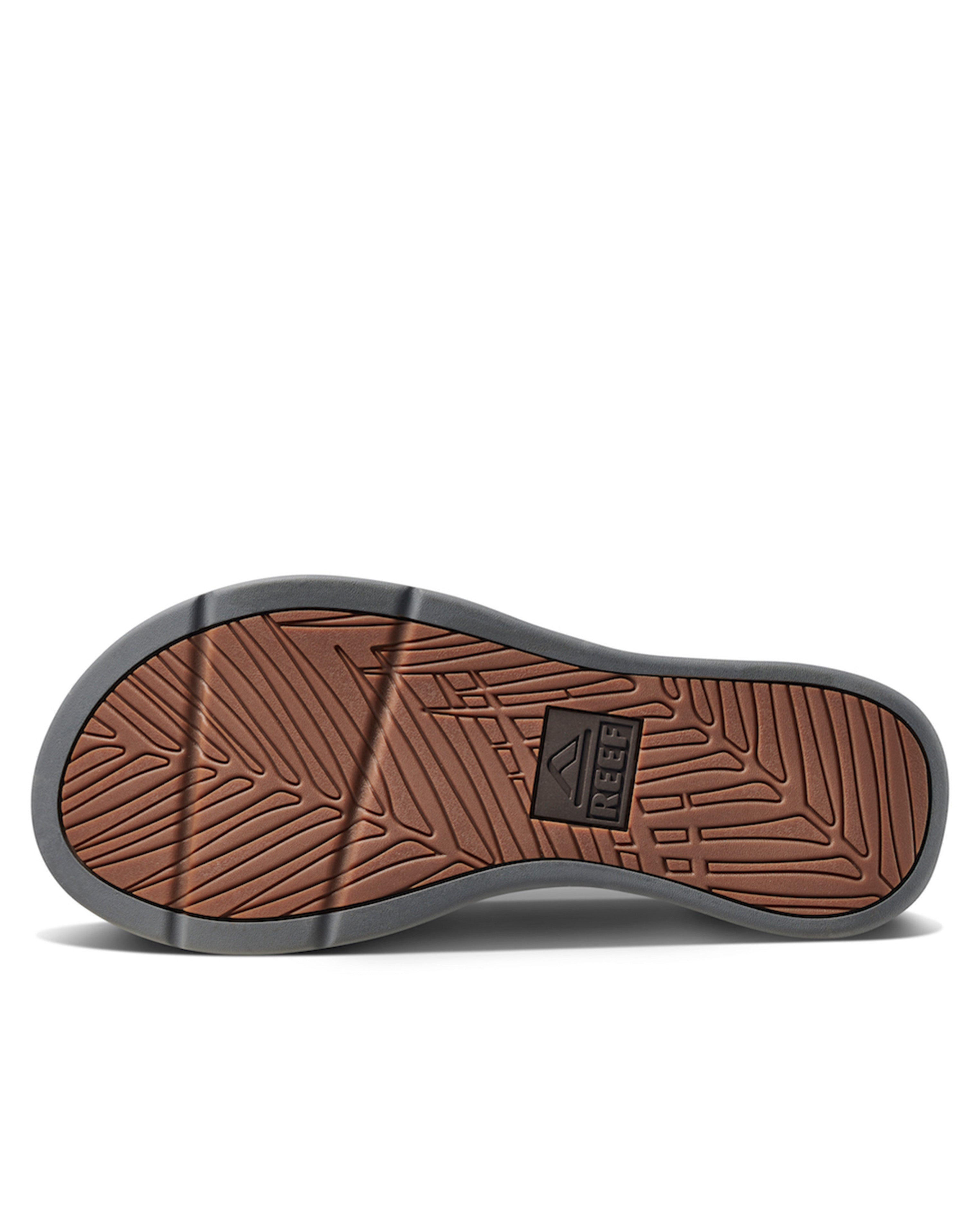 Textured brown and grey outsole of Reef thong sandal with logo detail.