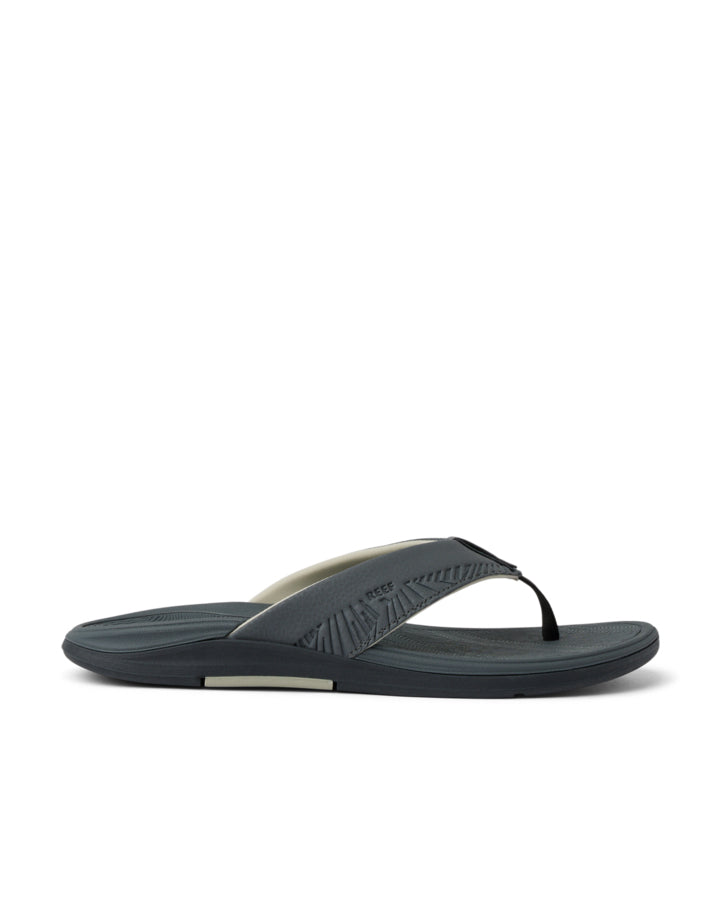 Reef men's dark grey thong sandal with cushioned sole and arch support, side profile view