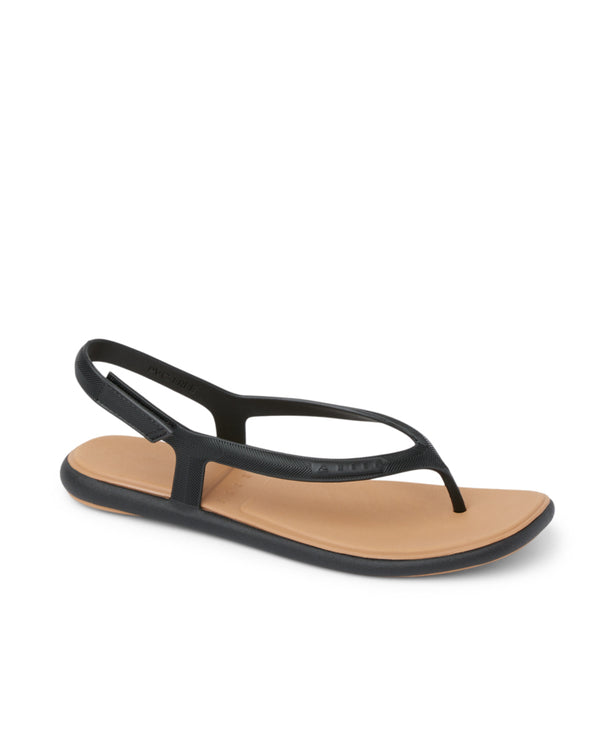 Black thong sandals with tan footbed, side angle.