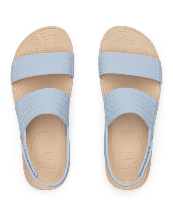Top view of women's Reef sandals in blue with cushioned footbed and double strap upper