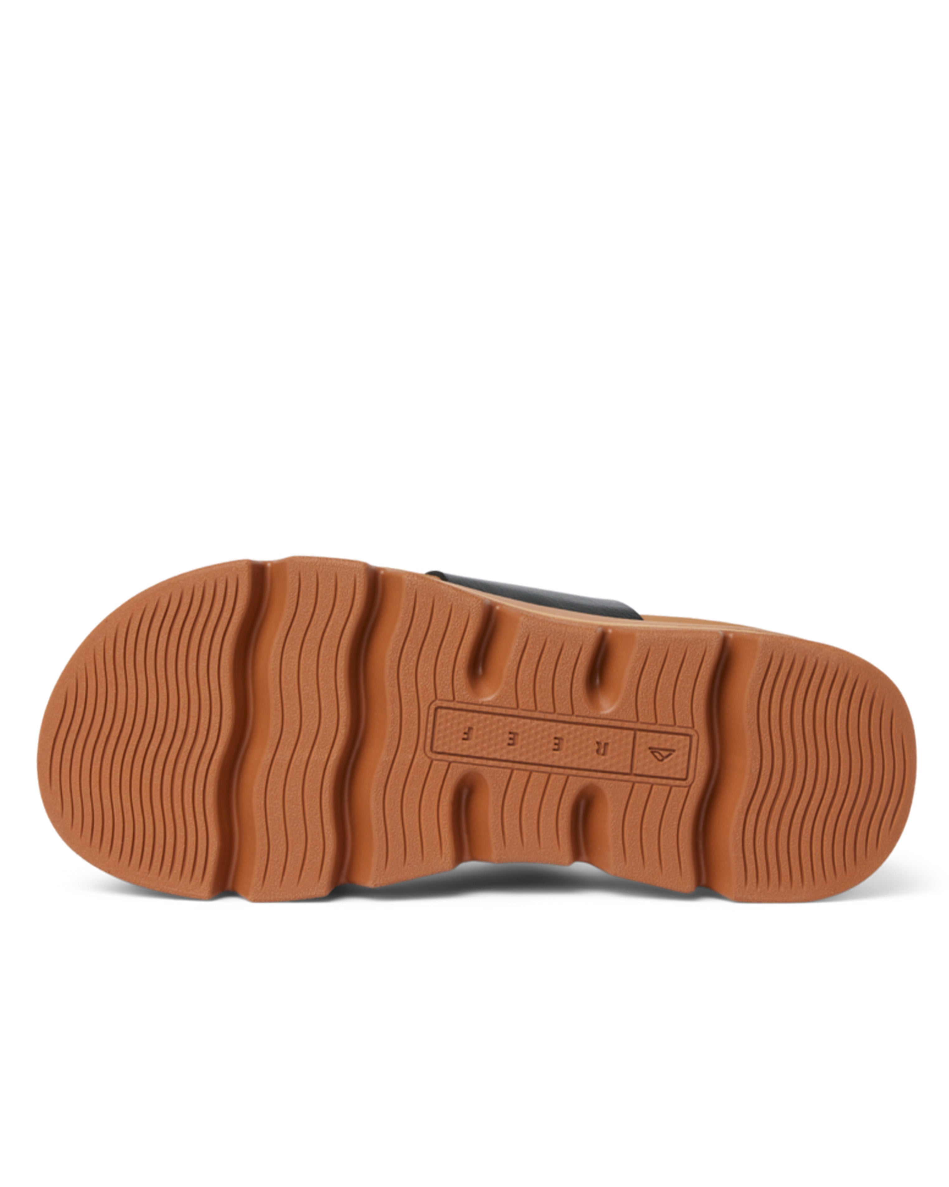 Bottom view of tan rubber sole with grippy tread and Reef branding