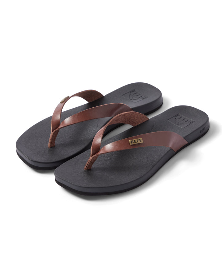 Side angle of Reef thongs with vegan leather straps and cushioned sole