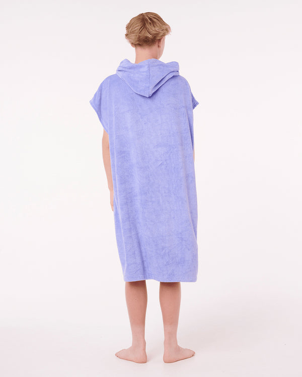 Back view of boy wearing a purple Rip Curl hooded towel with hood up.