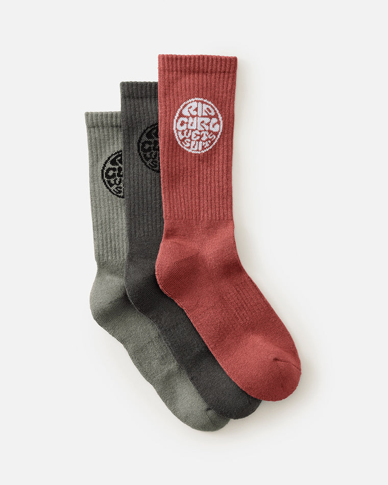 Three-pack of Rip Curl crew socks in red, charcoal, and olive with round logo design.