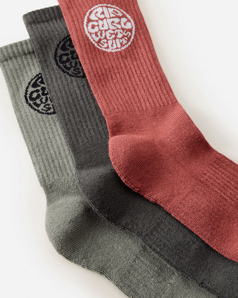Close-up of Rip Curl ribbed socks in assorted colours with retro-style logo.