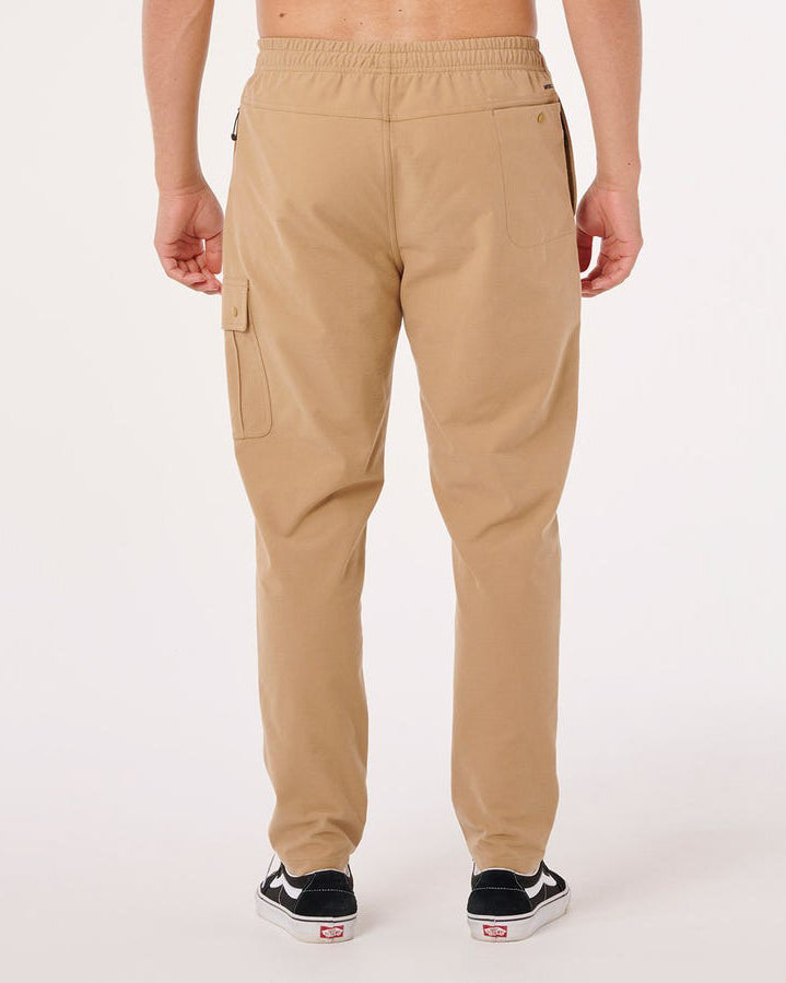 Back view of men's tan Billabong pants with rear pocket and cargo detailing.
