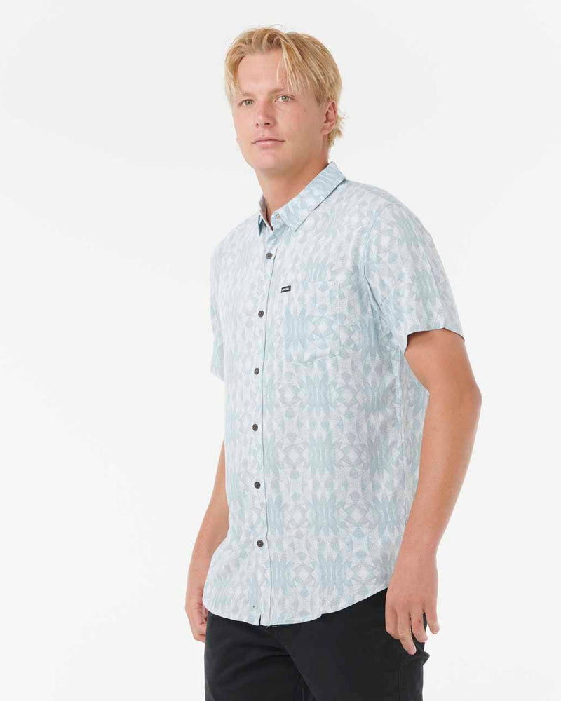 Angled view of light blue patterned shirt with chest pocket.