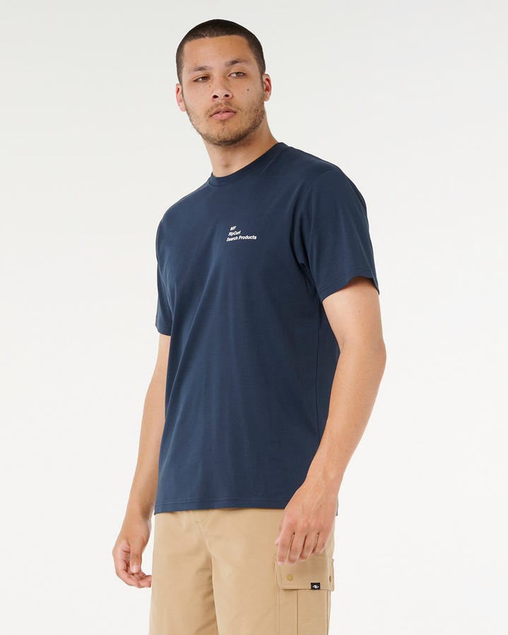 Side view of men's navy Rip Curl tee with minimalist chest print.