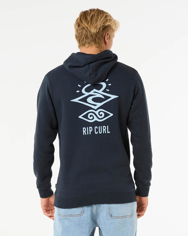 Man wearing a navy Rip Curl hoodie with a large back graphic in light blue, featuring a geometric surf-inspired design.