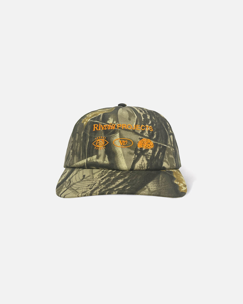 Front view of camo Rivvia Projects cap with embroidered symbols