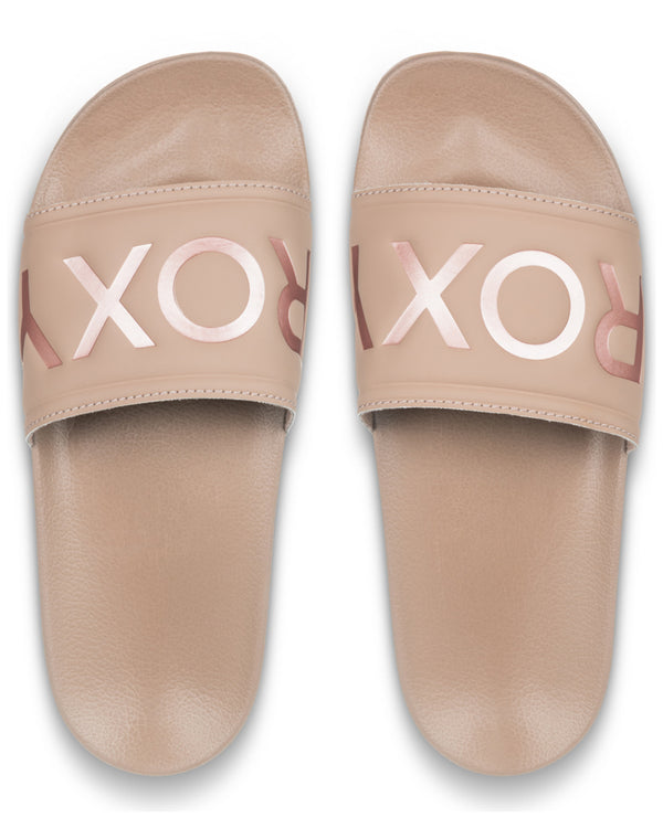 Top view of nude Roxy slides showing metallic logo across both foot straps