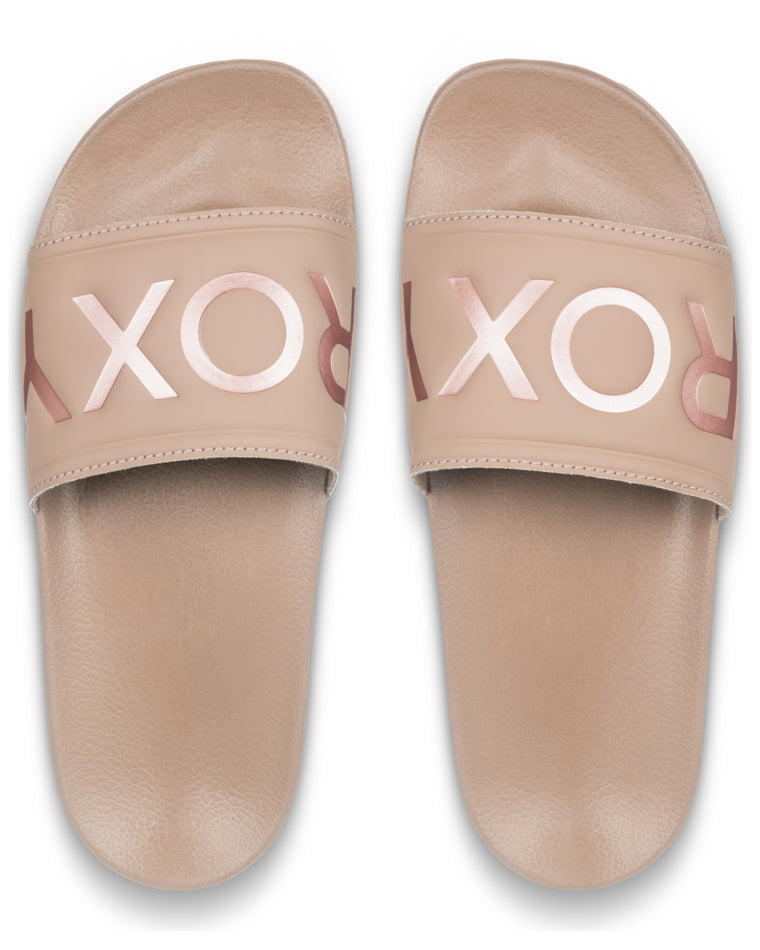 Top view of nude Roxy slides showing metallic logo across both foot straps