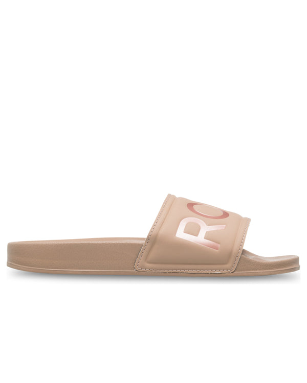 Side view of nude Roxy slide with wide strap and metallic pink logo lettering