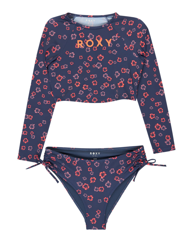 Navy floral girls’ long sleeve rash vest with matching high-waist bikini bottoms by Roxy.
