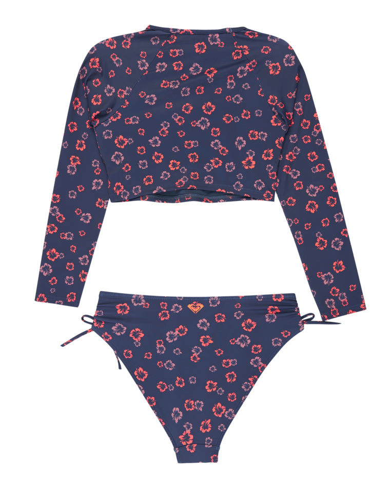 Back view of girls’ Roxy rash vest and bikini set in navy with red floral print and back logo detail.