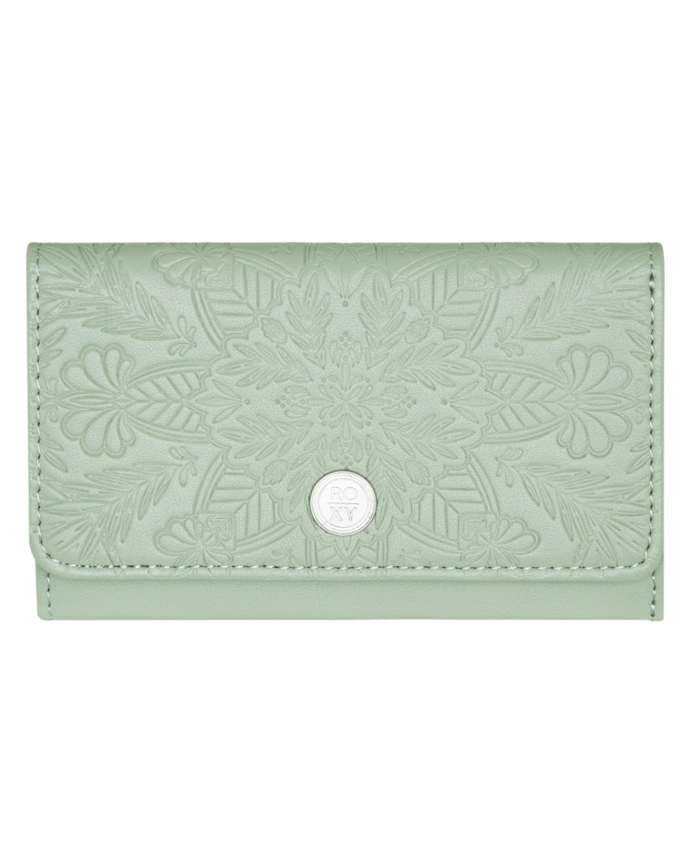 Light green Roxy wallet with embossed floral pattern and silver logo button on front flap.