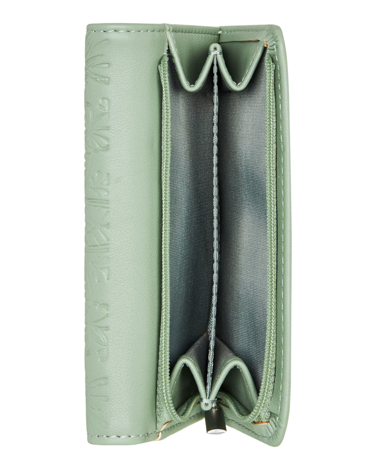 Side view of tri-fold light green Roxy wallet showing coin pouch with fabric-lined compartments.