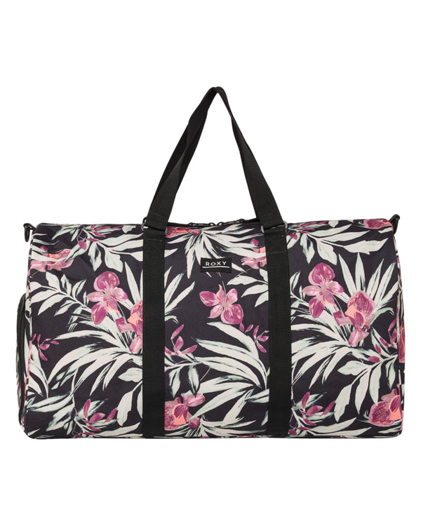 Roxy duffle bag with black base and tropical floral print, featuring dual top handles.