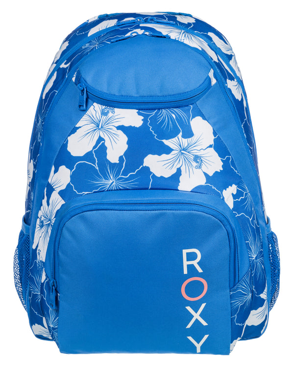 Blue Roxy backpack with a white floral print, multiple zippered compartments, mesh side pockets, and a bold vertical logo.