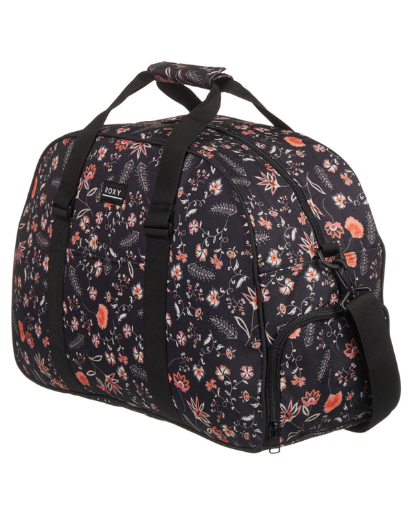 Roxy floral-print duffle bag with black handles, zippered main compartment, side pocket, and adjustable shoulder strap.