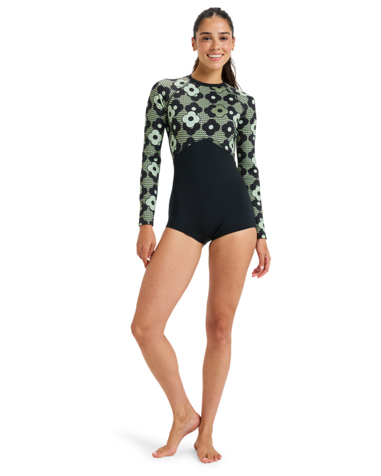 Full-body view of Roxy long sleeve spring suit in retro floral print and black colour-block design