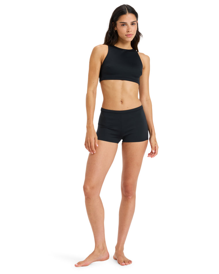 Full-body view of black Roxy swim set with sporty cut and minimal design.