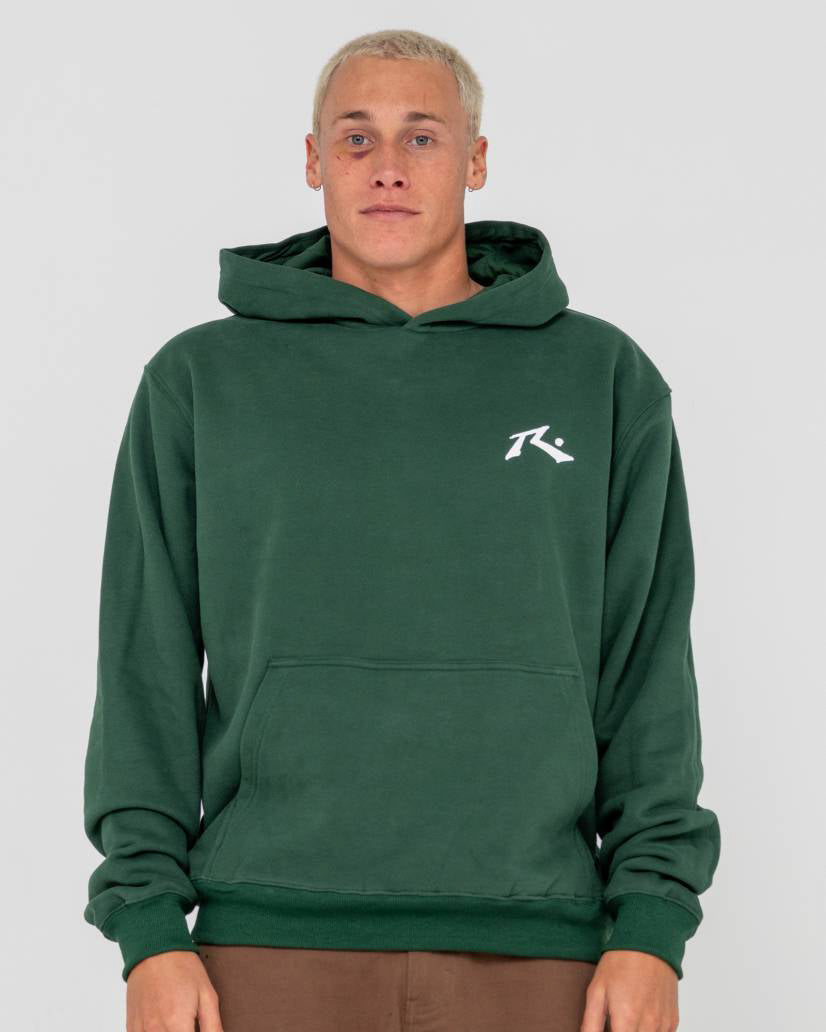 Model wearing a forest green hoodie with a small white logo on the chest, featuring a front pocket and ribbed cuffs.