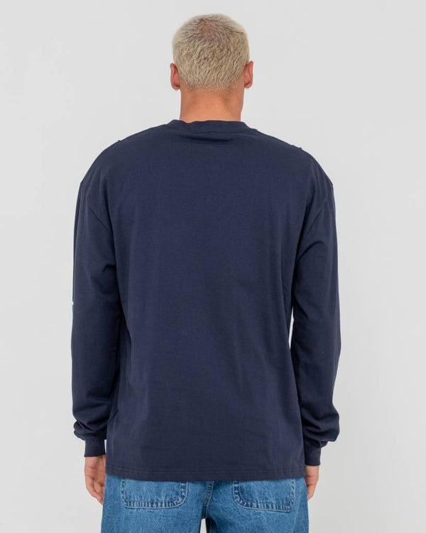 Model wearing a navy blue long-sleeve Rusty shirt, shown from the back with a plain design and relaxed fit.