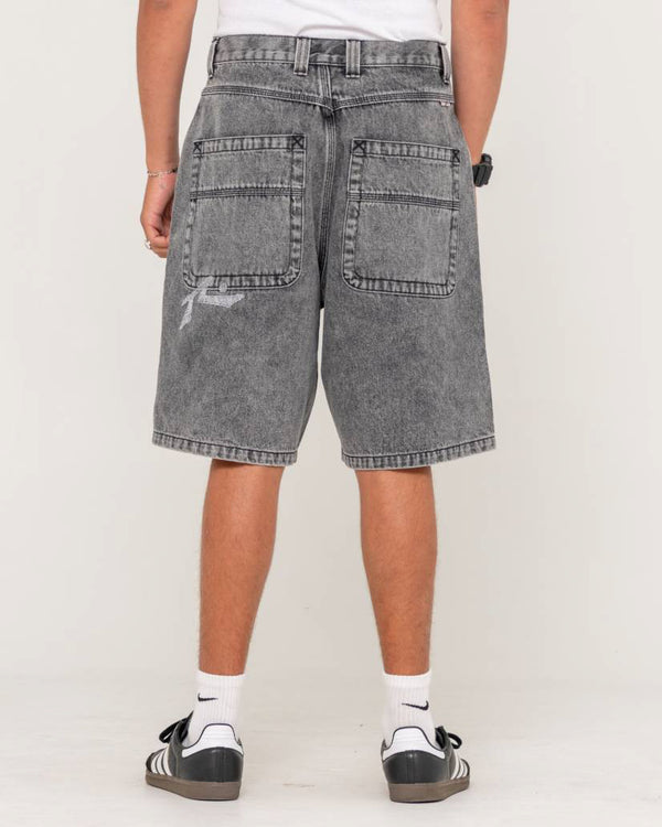 Back view of men's grey washed denim shorts with large square pockets, subtle distressing, and a relaxed fit.