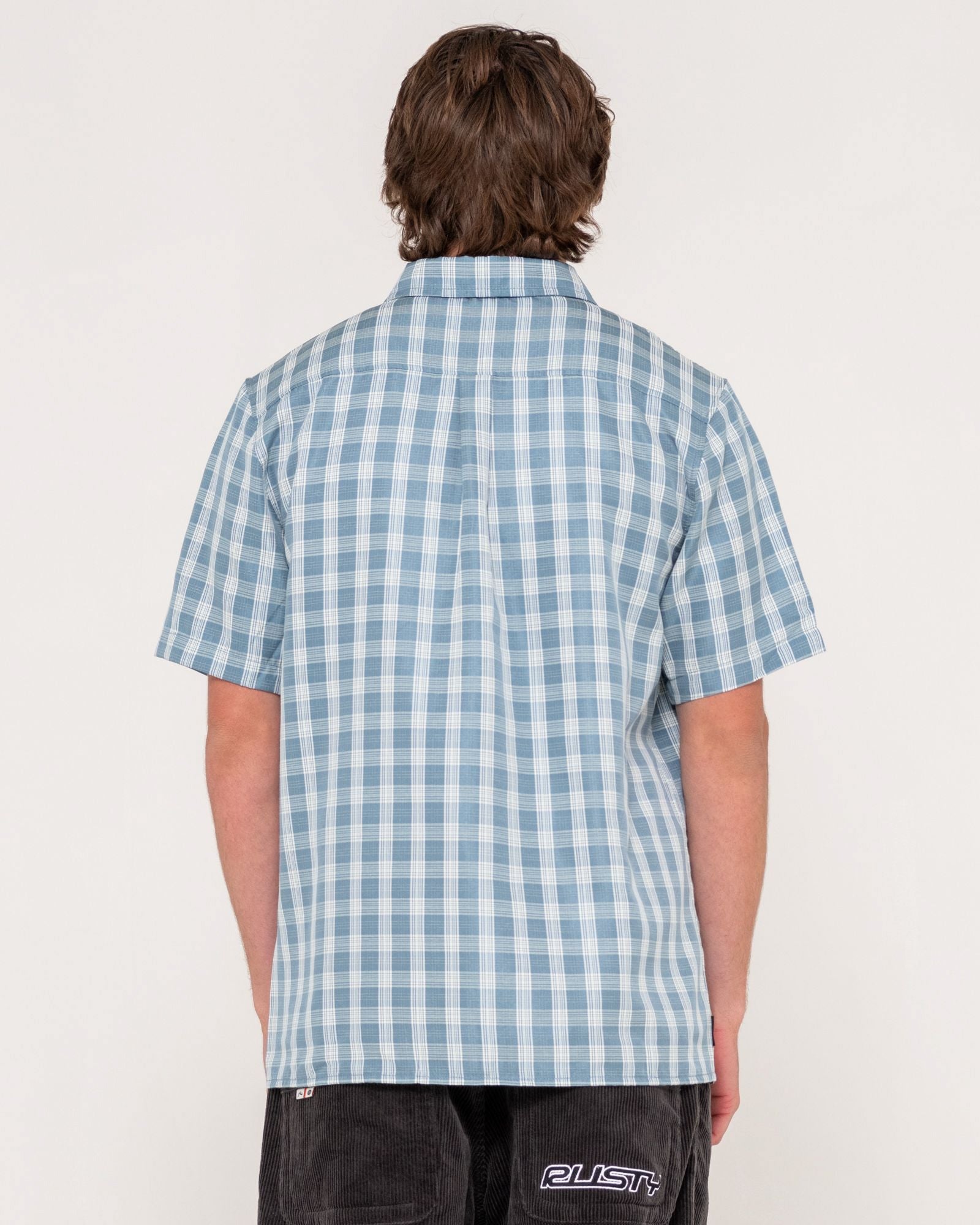Back view of blue check short sleeve shirt with classic straight hem and relaxed fit