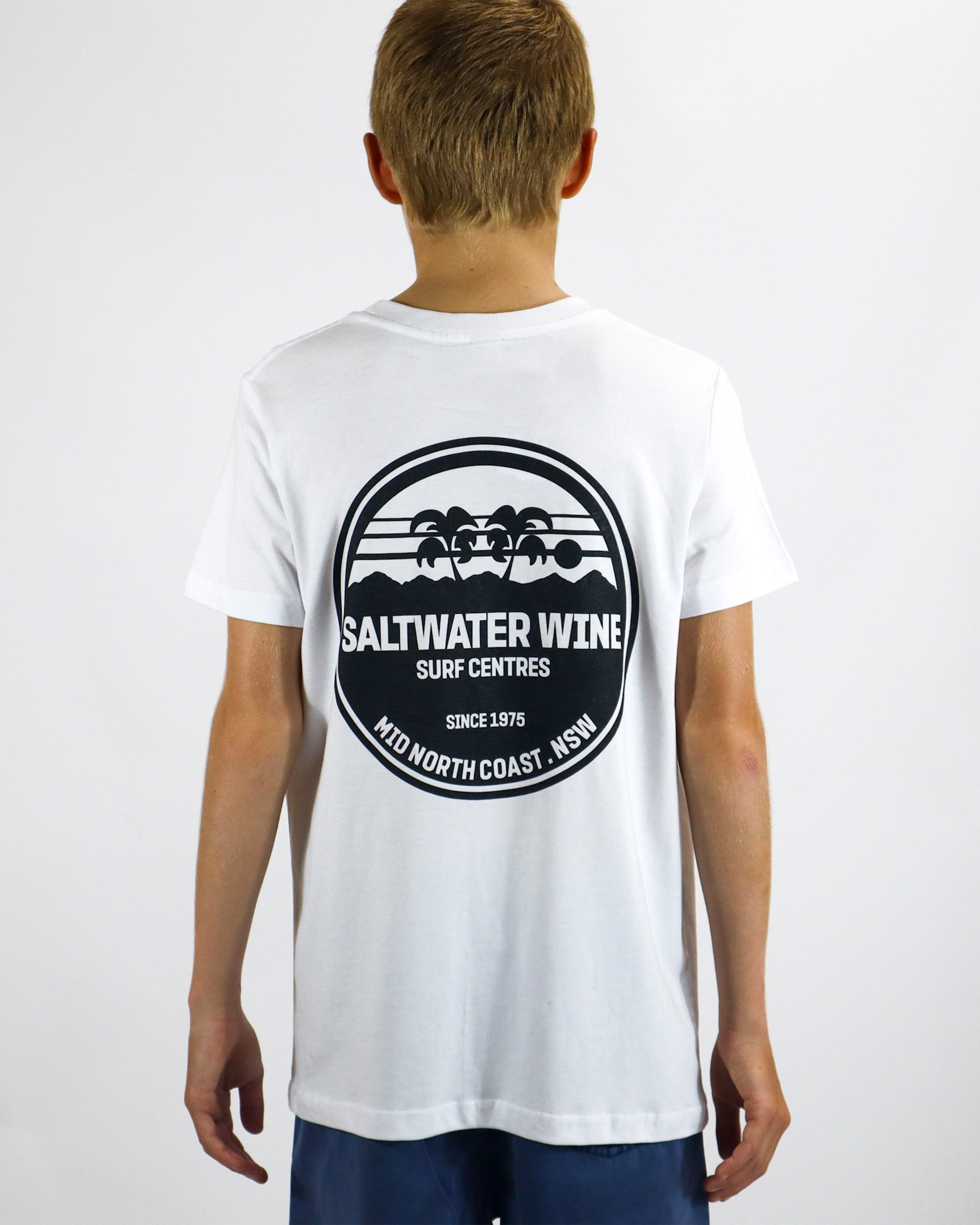 Back of white short sleeve t-shirt with large circular black Saltwater Wine logo and palm tree design.